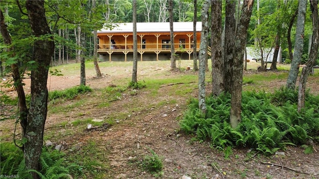 view of yard featuring a wooden deck