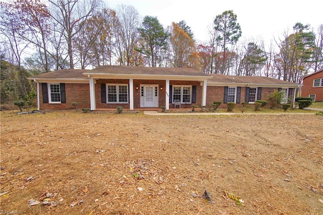 ranch-style home featuring covered porch