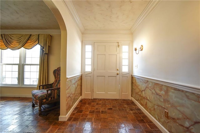 foyer featuring crown molding