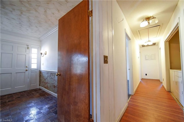 foyer entrance featuring wood-type flooring and ornamental molding