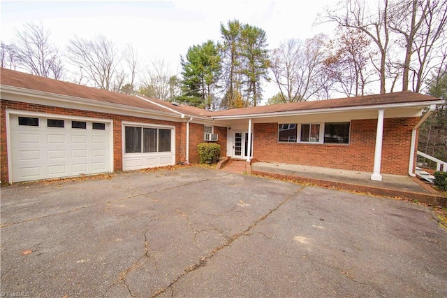 single story home with a garage