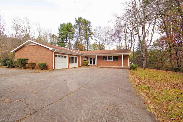 single story home with a garage