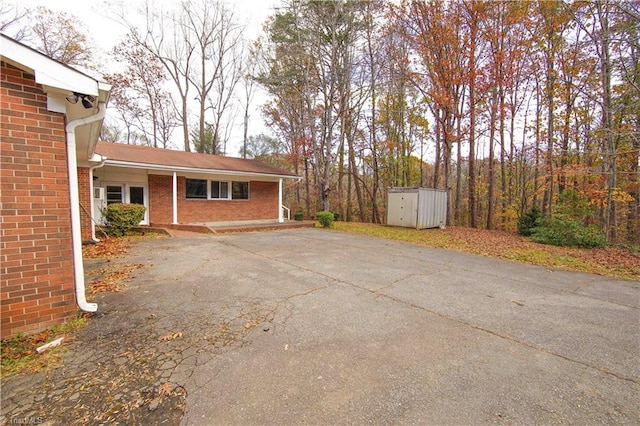 exterior space with a storage shed