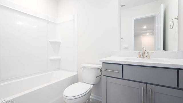 bathroom with toilet, vanity, and bathtub / shower combination