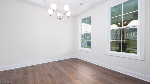 unfurnished room with dark wood-type flooring, a notable chandelier, and baseboards