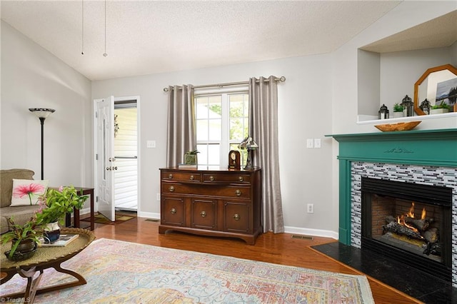 3714 Courtland Cir, Thomasville, NC 27360 - living area with wood finished floors and a tiled fireplace