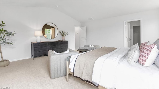 247 Lisa Ln, Winston-Salem, NC 27107 - carpeted bedroom featuring vaulted ceiling and baseboards