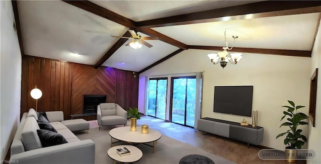 carpeted living room with wooden walls, ceiling fan with notable chandelier, and vaulted ceiling with beams