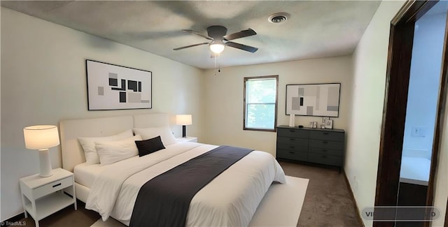 carpeted bedroom featuring visible vents and ceiling fan