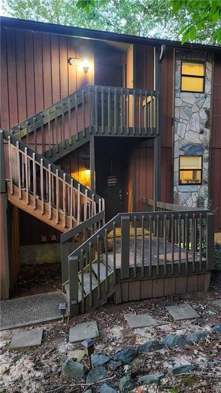 back of property featuring board and batten siding