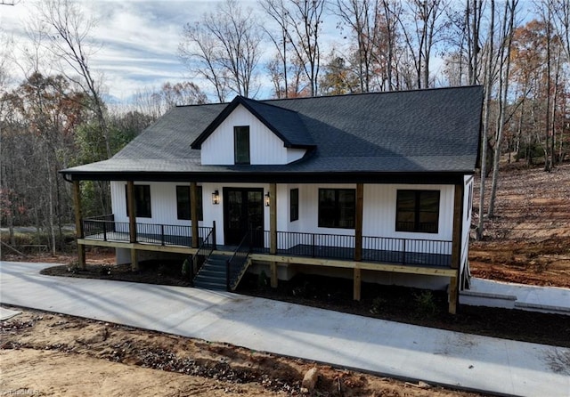 modern farmhouse featuring a porch and french doors