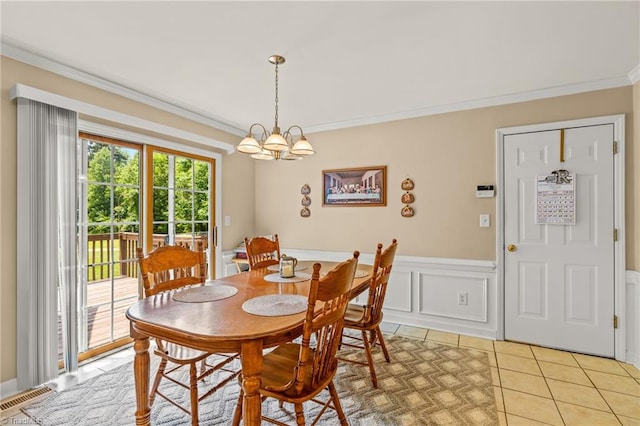 5805 Pine Hall Rd, Walnut Cove, NC 27052 - dining area with ornamental molding, a chandelier, wainscoting, and light tile patterned flooring