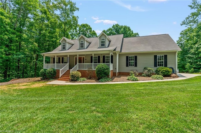 5805 Pine Hall Rd, Walnut Cove, NC 27052 - cape cod house featuring a porch and a front lawn