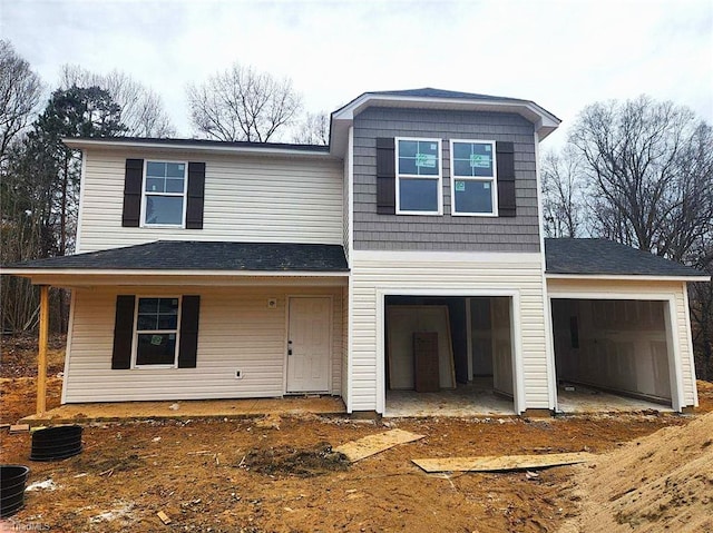 view of front of property with a shingled roof