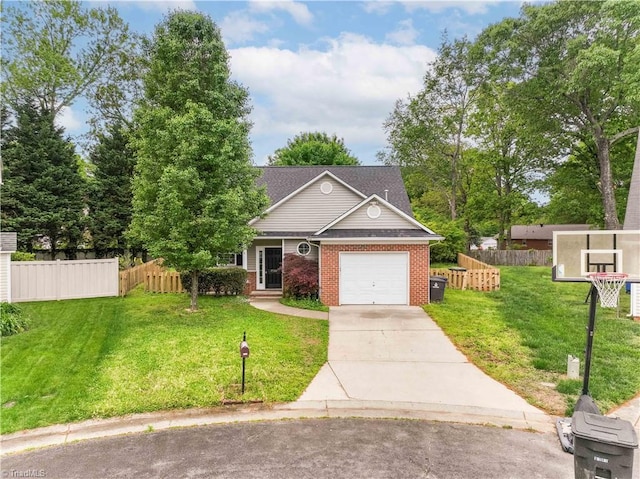 traditional-style home with fence, an attached garage, a front lawn, brick siding, and concrete driveway