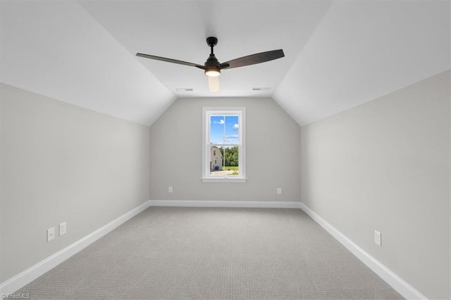 additional living space with visible vents, baseboards, a ceiling fan, lofted ceiling, and carpet flooring