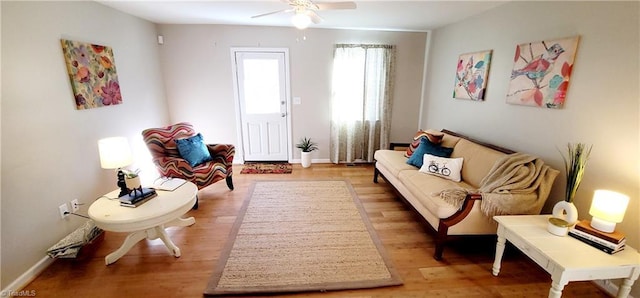 sitting room featuring hardwood / wood-style flooring and ceiling fan