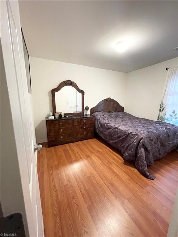 bedroom with light hardwood / wood-style flooring