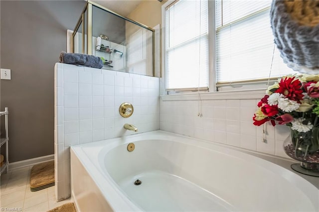 bathroom featuring tile patterned flooring and a bathtub