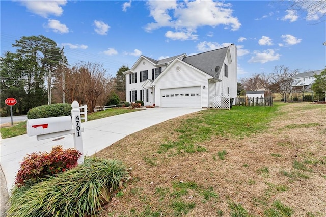 view of side of property featuring a yard and a garage