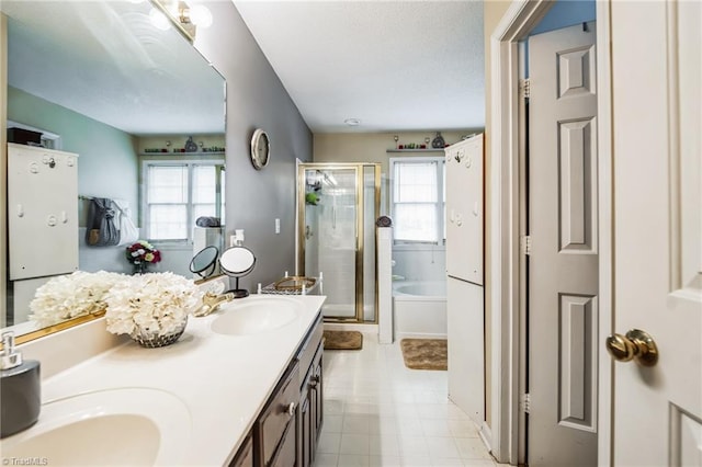 bathroom featuring plus walk in shower and vanity