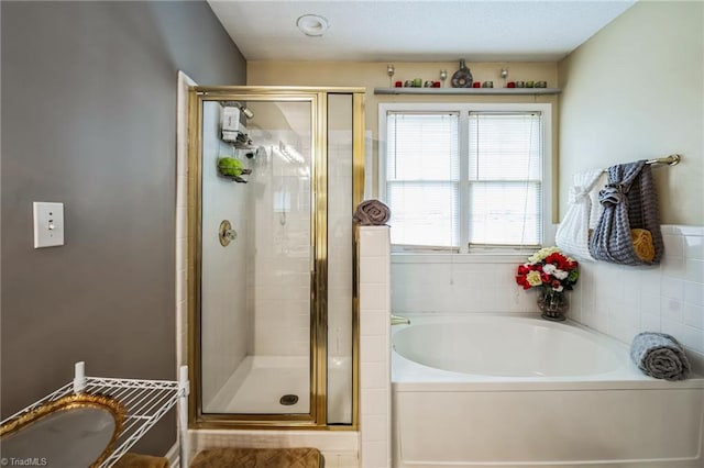 bathroom with separate shower and tub