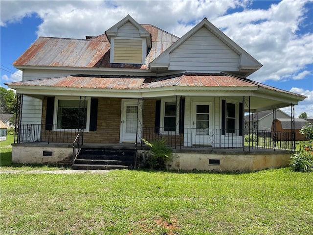 705 Washington St, Graham, NC 27253 - view of front of home with crawl space, a porch, a front lawn, and metal roof