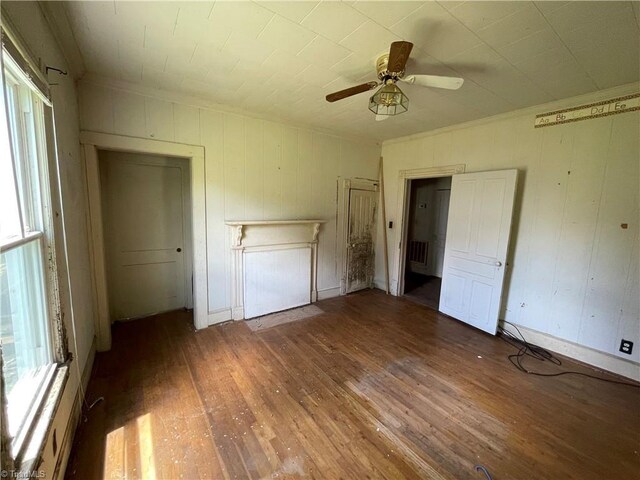 705 Washington St, Graham, NC 27253 - unfurnished bedroom with wood-type flooring and ceiling fan