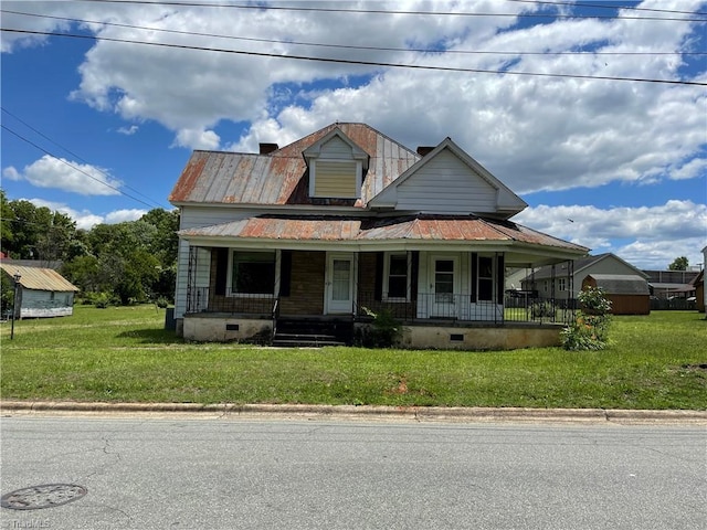 705 Washington St, Graham, NC 27253 - view of front facade featuring crawl space, covered porch, a front yard, and metal roof