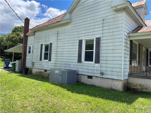 705 Washington St, Graham, NC 27253 - view of side of home featuring crawl space, cooling unit, a lawn, and metal roof