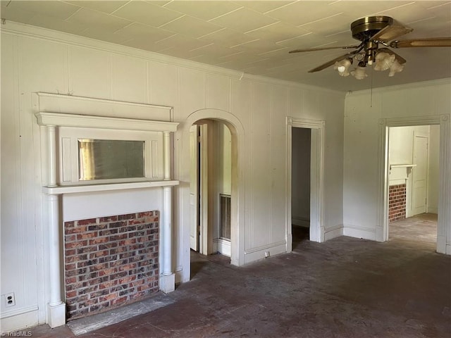 705 Washington St, Graham, NC 27253 - unfurnished living room with a ceiling fan, crown molding, arched walkways, and carpet floors