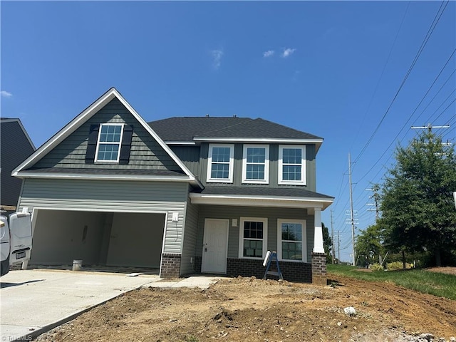 3301 Alyssa Way Lot 1, High Point, NC 27265 - view of front of house with driveway, a porch, brick siding, a garage, and roof with shingles