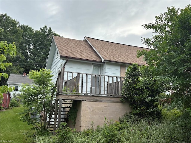 223 Flint Hill Rd, North Wilkesboro, NC 28659 - back of house with roof with shingles and stairway