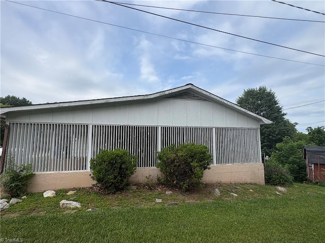223 Flint Hill Rd, North Wilkesboro, NC 28659 - view of property exterior with a yard and concrete block siding