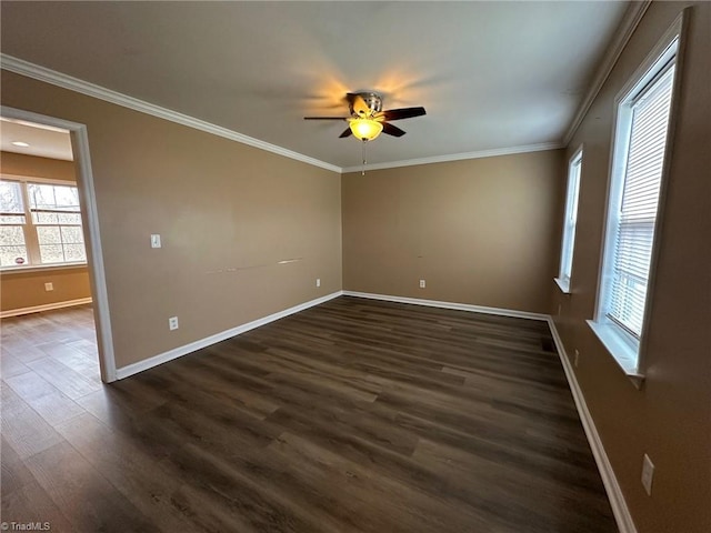 spare room featuring dark wood-type flooring, ceiling fan, and ornamental molding