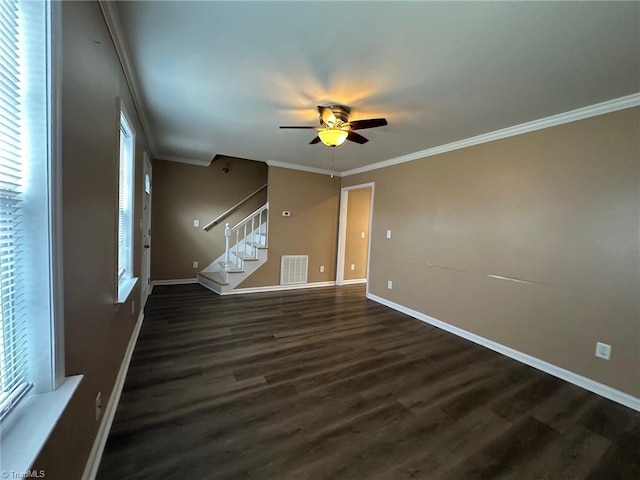 unfurnished room with crown molding, ceiling fan, and dark hardwood / wood-style flooring