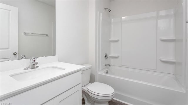 full bathroom featuring vanity, bathtub / shower combination, and toilet