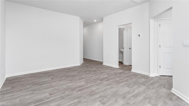 spare room featuring light hardwood / wood-style flooring