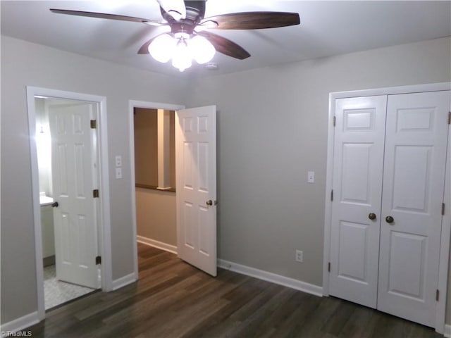 1074 Hickory Glen Rd, Winston-Salem, NC 27106 - unfurnished bedroom with dark wood-type flooring, a closet, a ceiling fan, and baseboards