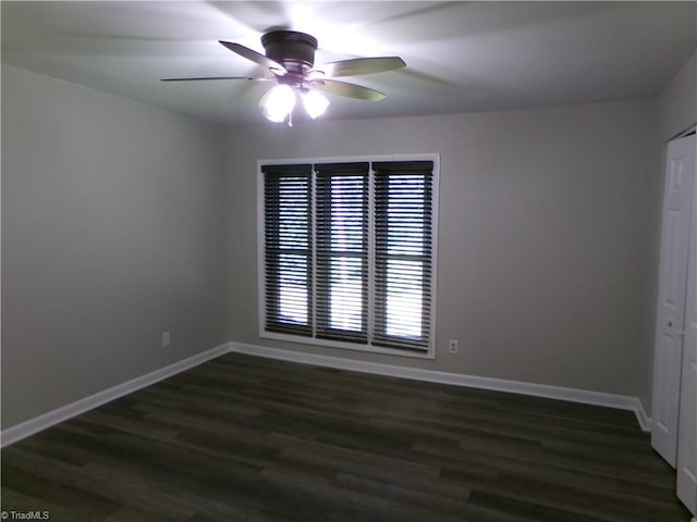 1074 Hickory Glen Rd, Winston-Salem, NC 27106 - unfurnished room with a ceiling fan, dark wood-type flooring, and baseboards