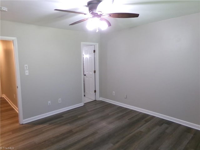 1074 Hickory Glen Rd, Winston-Salem, NC 27106 - unfurnished room with dark wood-style flooring, ceiling fan, and baseboards
