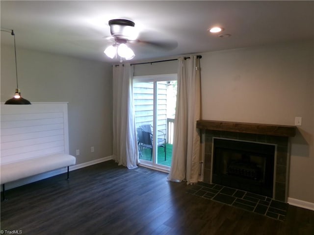 1074 Hickory Glen Rd, Winston-Salem, NC 27106 - unfurnished living room featuring dark wood-style floors, a tiled fireplace, baseboards, a ceiling fan, and recessed lighting