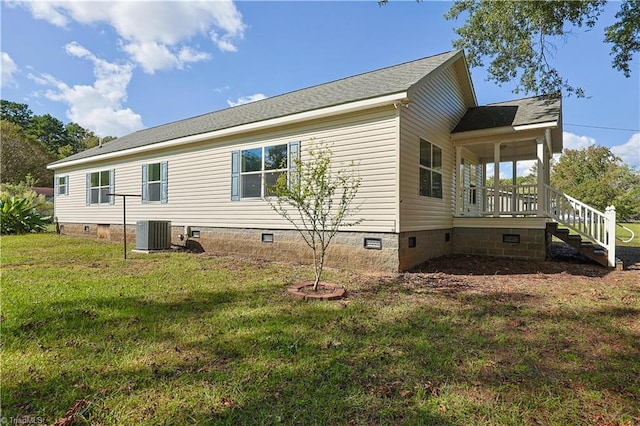 view of home's exterior with a lawn and central air condition unit