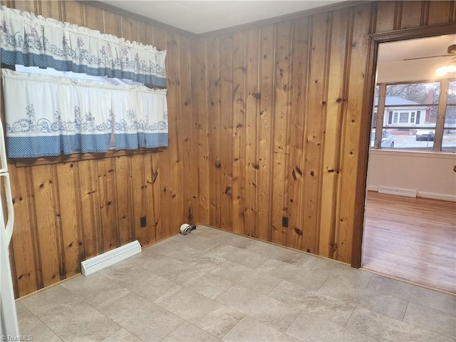 unfurnished room with visible vents and wooden walls