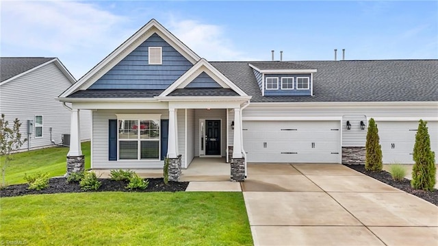 6624 Knob Creek Dr, Whitsett, NC 27377 - craftsman inspired home with driveway, a front yard, covered porch, and a shingled roof