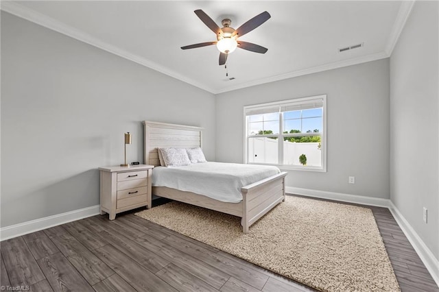 6624 Knob Creek Dr, Whitsett, NC 27377 - bedroom with dark wood finished floors, ornamental molding, baseboards, and a ceiling fan