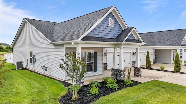6624 Knob Creek Dr, Whitsett, NC 27377 - view of front of property with a garage, a shingled roof, a front yard, and driveway