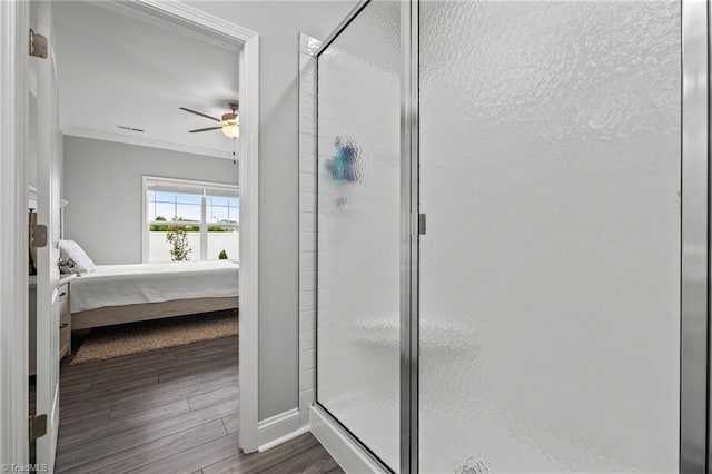 6624 Knob Creek Dr, Whitsett, NC 27377 - bathroom with ensuite bath, crown molding, a shower stall, ceiling fan, and wood finished floors