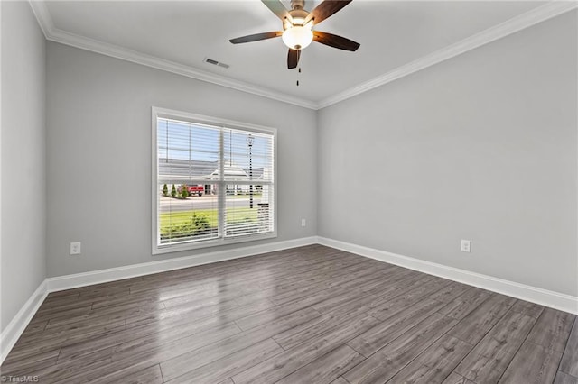 6624 Knob Creek Dr, Whitsett, NC 27377 - unfurnished room featuring dark wood-style floors, ornamental molding, a ceiling fan, and baseboards