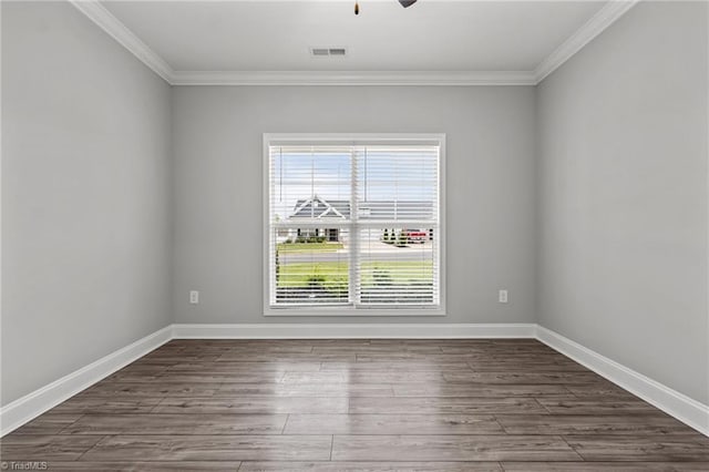 6624 Knob Creek Dr, Whitsett, NC 27377 - spare room with crown molding, dark wood-style floors, baseboards, and a ceiling fan